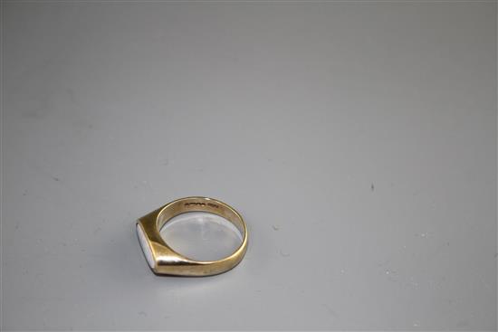 A modern 9ct gold and collet set white opal set dress ring, size M, gross weight 3.9 grams.